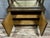 Art Deco period bookcase in lacquered wood with a decoration imitating rusted, patinated sheet metal, circa 1930-1940....