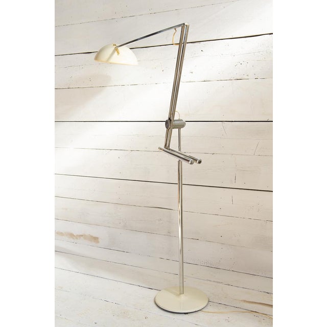 Floor lamp with metal counterweight. Designer Goffredo Reggiani created this lamp in the early 1960s. The table version is...