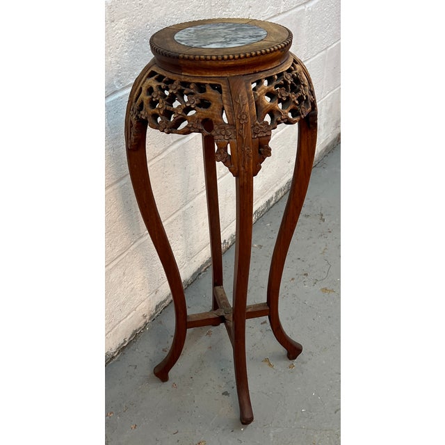 Elegant and timeless, this Antique Chinese Carved Inset Marble Pedestal is a striking example of traditional...