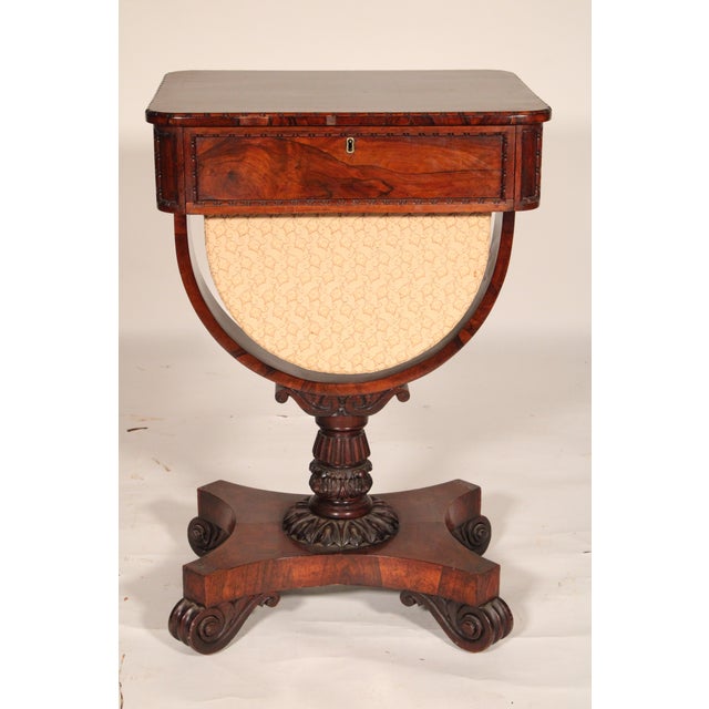 William IV rosewood and mahogany side / sewing table, circa 1835. With a mahogany top with rounded corners, a rosewood...