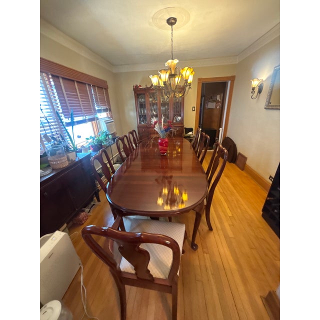 Bring timeless American craftsmanship into your home with this exceptional Ethan Allen dining set. Built from solid...
