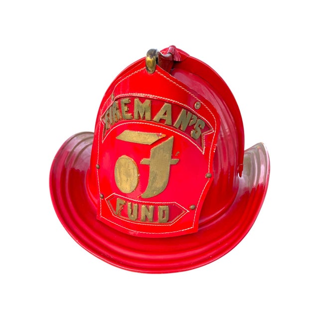 Beautiful vintage Cairns & Bro. "Fireman's Fund" helmet. Aluminum body with leather badge and liner. The inner emblem...