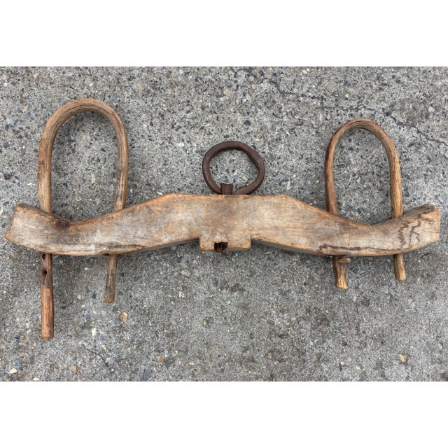 Antique double oxen yoke with forged iron hardware on carved wood. A large primitive statement piece. Please see condition...