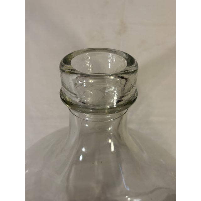 Beautiful vintage large French demijohn. Clear in color so it blends with any decor. It is in excellent condition, no...