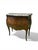 An elegant louis xv style bombé commode, stamped, with richly decorated marquetry and chased bronze mounts. its front...