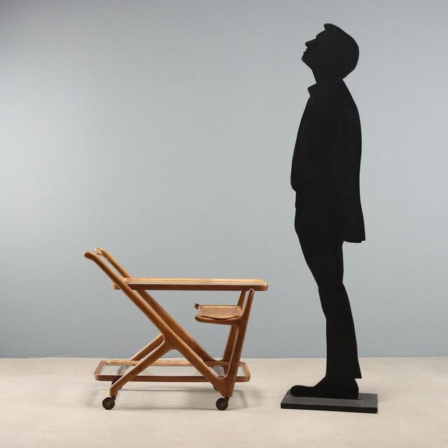 1950s service trolley made of beech wood, featuring an elegant and functional design attributed to Cesare Lacca. The...