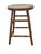 A charming antique country stool featuring a thick circular wooden seat, four elegantly turned legs, and an elaborate...