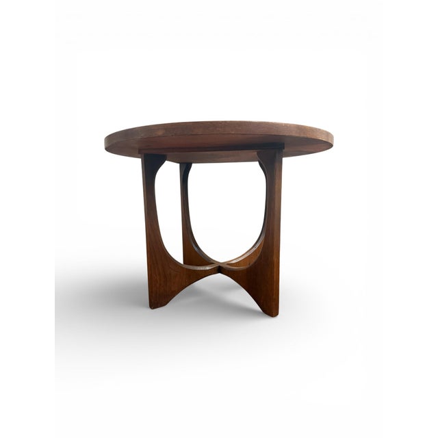 A beautifully sculptural mid-century modern round side table from the iconic Brasilia collection by Broyhill Furniture,...