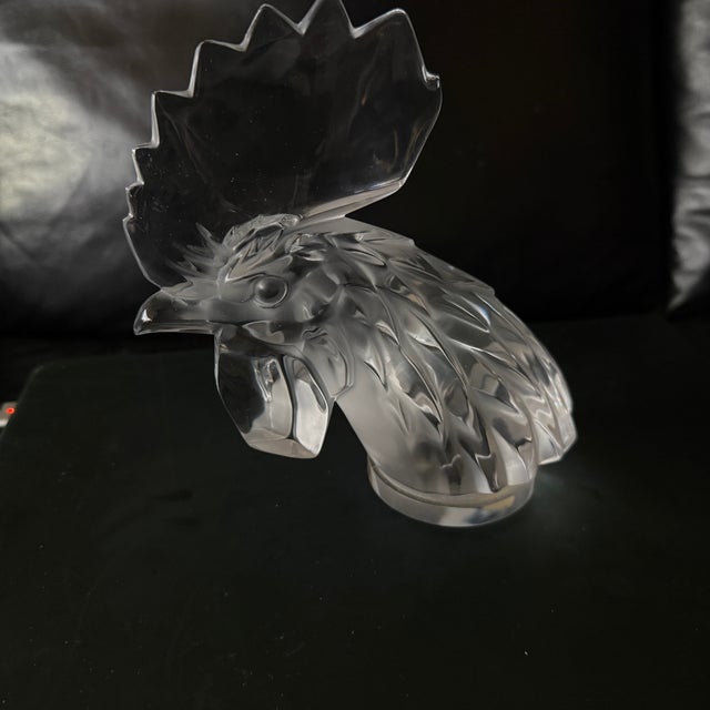 This Lalique Rooster Head (formally titled Tête de Coq) is a celebrated piece of French Art Deco crystal. Originally...
