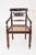 Each with back centered by foliate-carved open backsplat; with reeded downswept armrests resting on baluster-form...