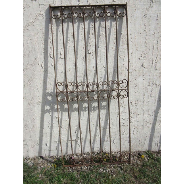 This antique Victorian iron gate is a wonderful piece of architecture. Heavy, tight, and sturdy. Piece does show signs of...
