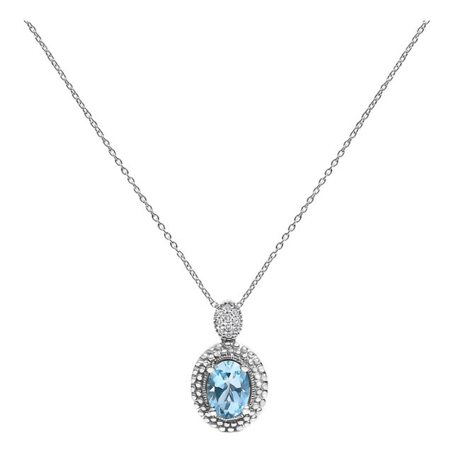 .925 Sterling Silver Oval Blue Topaz and Diamond Accent with Beaded Halo Pendant Necklace - 18" Inches For Sale