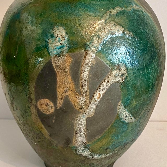 Large vase with matte black reduction lines, and highly unique mottled turquoise, jade, and copper-green glazes all the...