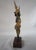 Gilded Cast Bronze figure of a Siamese Buddha mounted on a wood base. Gilt Finish over bronze, it measures 11"H x 3"W x...