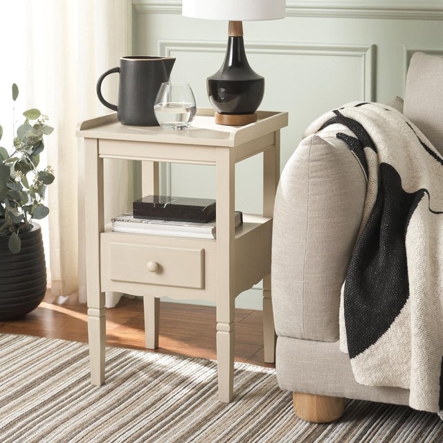 Introducing the Araminta One Drawer Accent Table in a tranquil Sand color. This elegantly simple piece offers a practical...