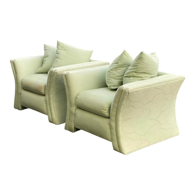 Pair of designer lounge chairs manufactured by Royal Lounge Co. of West Haven, Connecticut featuring curved sides and down...