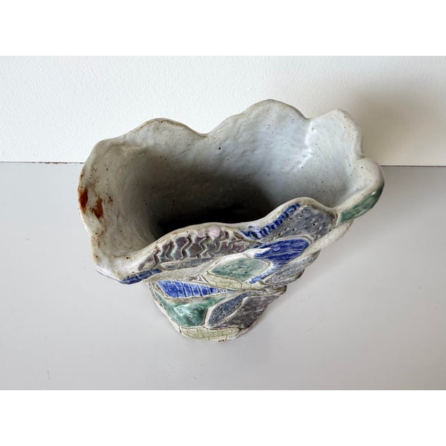 Exceptional 1990s handmade studio pottery vase featuring an expressive abstract sculptural form with a free-flowing...