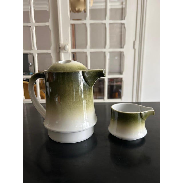 A 1970s porcelain tea set produced by Langenthal, Switzerland. Teapot: 18cm high, 20/12cm diameter Milk jug: 7cm high, 9cm...