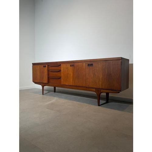 An exceptional teak sideboard by Greaves & Thomas, one of Britain’s most respected mid-century furniture manufacturers....