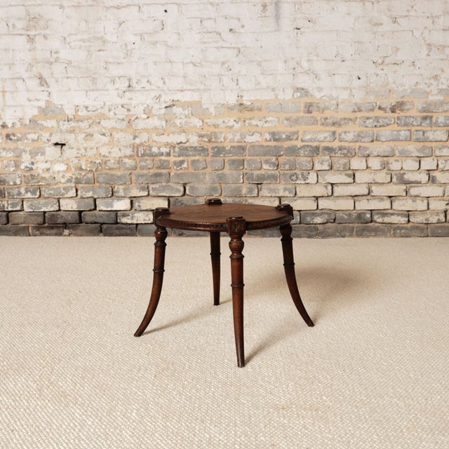 Add understated French charm to your space with this early 20th century French wooden round table, a beautifully crafted...