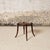 Add understated French charm to your space with this early 20th century French wooden round table, a beautifully crafted...