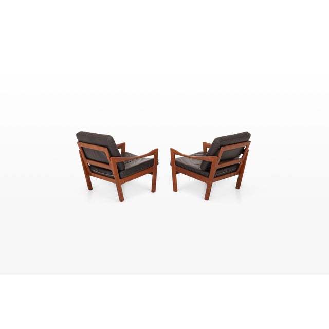 An exceptional pair of easy chairs designed by renowned danish designer illum wikkelsø for niels eilersen in the 1960s....