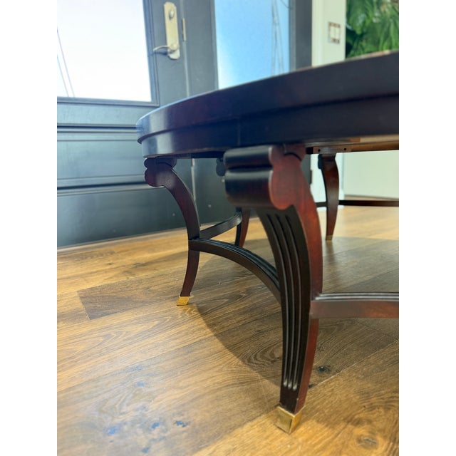 Mid 20th Century Attributed to Hickory Chair Company Flame Mahogany Round Coffee Table With Brass Sabots For Sale - Image 5 of 12