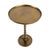 Retro modern style antiqued brass finish aluminum side table. Round top with scalloped pedestal base. Each will vary in...