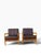 OVERVIEW A matched pair of mid-century Danish modern lounge chairs in brown leather on sculpted maple frames. Their broad...
