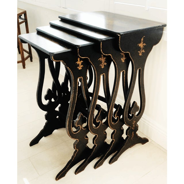 Elegant vintage nesting tables by Hickory Chair featuring richly detailed chinoiserie scenes with Asian-inspired figures...
