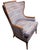Louis XVI Revival carved walnut fauteuil armchair, dating to the 20th century, distinguished by its finely carved...