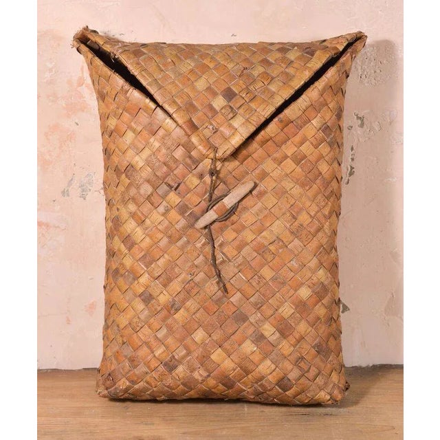 Swedish fruit basket. This charming woven construction basket closes with flap secured by leather strap.