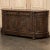 19th Century French Walnut Neoclassical Buffet with Four Seasons is a stunning work of art that also happens to perform...