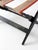 Vintage folding luggage rack dating from the 1920s–1940s with black painted wood frame and striped canvas webbing. Stepped...
