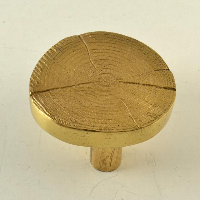 A luxurious and sculptural round push–pull door handle, European, 1970s, in the style of Ado Chale. The design evokes the...