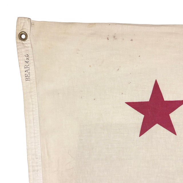 This large vintage California flag is made from a cotton cloth, with sewn stripe and printed bear design visible on both...
