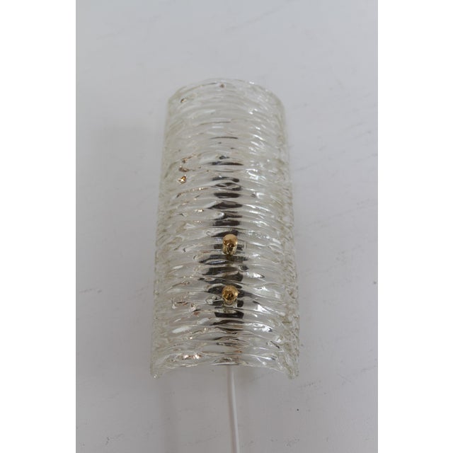 Swedish Mid-Century Glass and Brass Sconce, 1960s. Lovely Scandinavian Mid-Century Modern brass wall light with a clear...