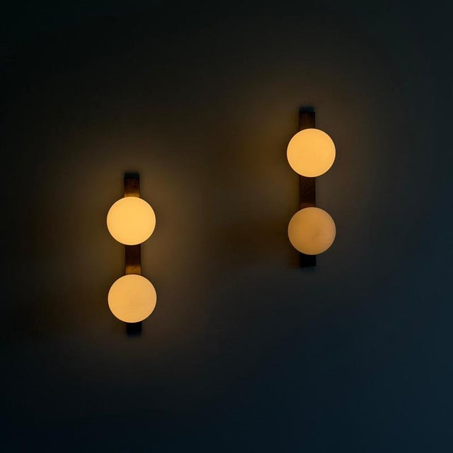 An elegant and increasingly difficult-to-find pair of wall sconces produced by Stilnovo, Italy, during the 1960s. Defined...