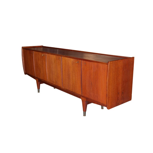 Classic Danish, teak sideboard/credenza designed in the style of Alf Aarseth for Gustav Bahus, or Anderson. 5 doors, each...