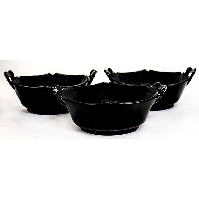 Set of 3 black Depression Glass bowls with handles. Sleek mid-century design.