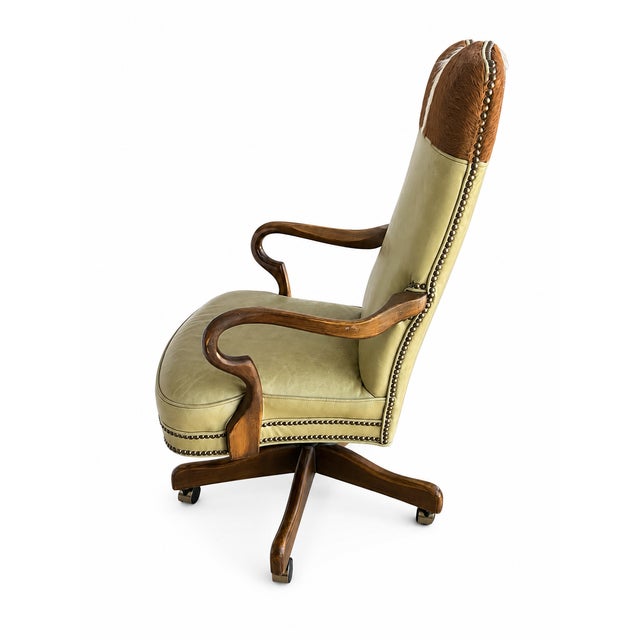 Classic adjustable executive office chair manufactured by Old Hickory Tannery, known for quality leather furnishings and...