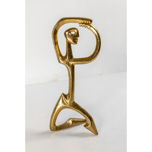 We are selling this lovely mid-century modern bronze by Frederick Weinburg. The bronze is of a dancer and signed on the...
