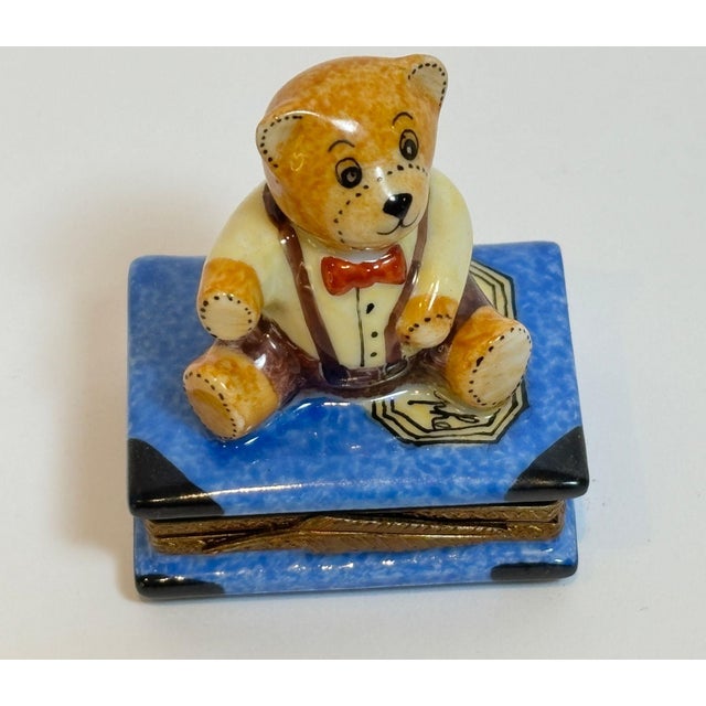 Vintage Limoges Porcelain Box with Teddy Bear on Book, Hand-Painted, France, ca. 20th Century A charming hand-painted...