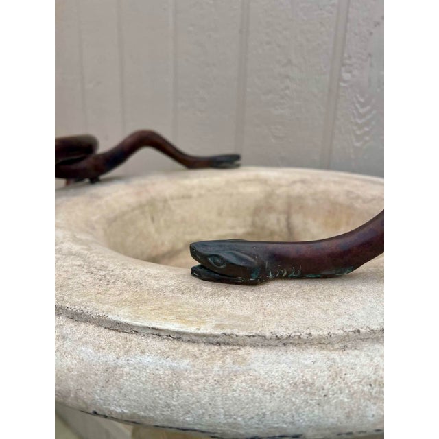 Stunning cast stone piece, that came from a Michael Taylor showroom before he company closed. The urn and base are separate.