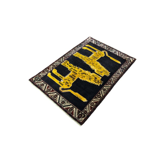 A fascinating hand-knotted Gabbeh nomad rug with strong symbolic significance: Two stylized lions face each other head-on...