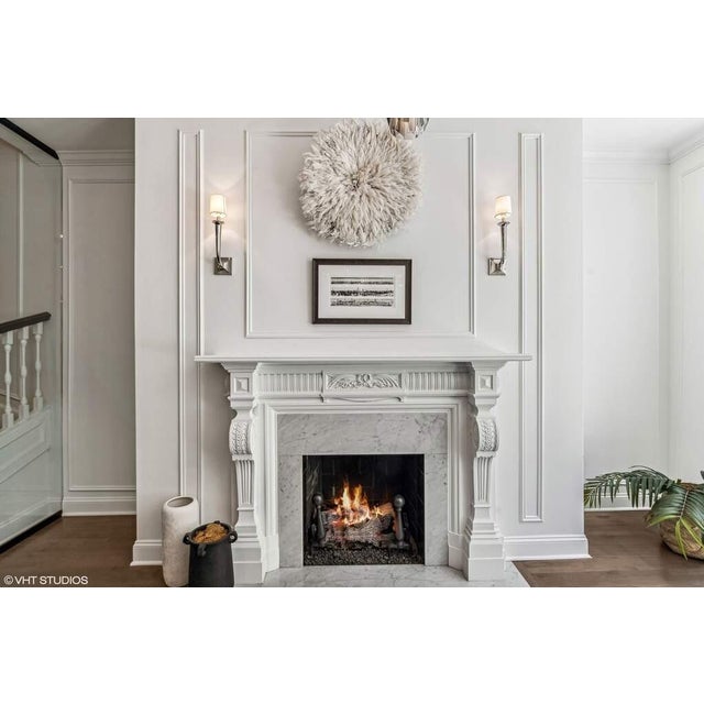 Handsome pair of vintage cast iron fireplace andirons featuring classic cannonball finials, tapered baluster-form...