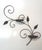 Salterini-style iron wall planter in a scrolled design with texture leaf accents. This vintage planter has raised ruffled...