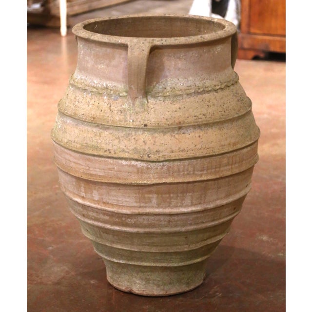 This substantial antique terracotta jar was crafted in Italy circa 1870 and displays the strong sculptural form and...