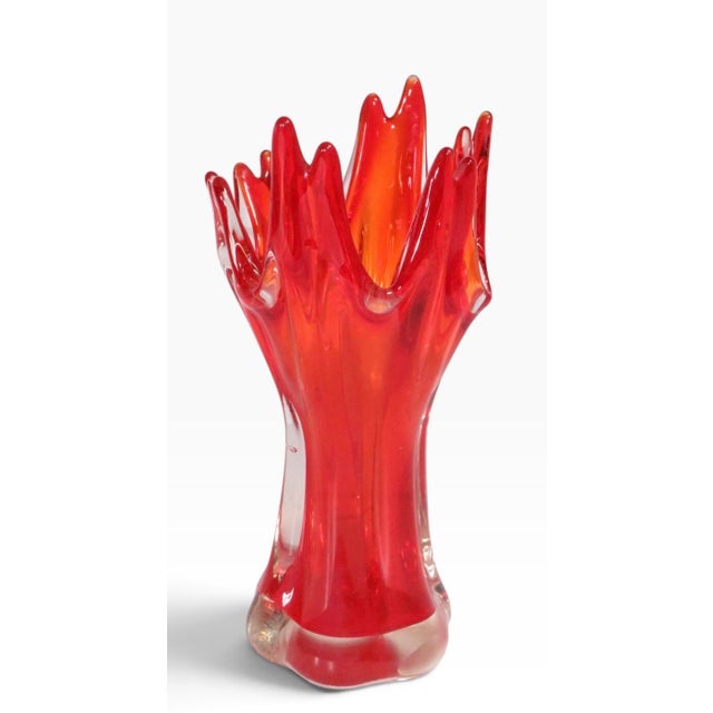 Mid Century art glass vase having a red and clear body, and stylized crown form top. This example is in excellent,...