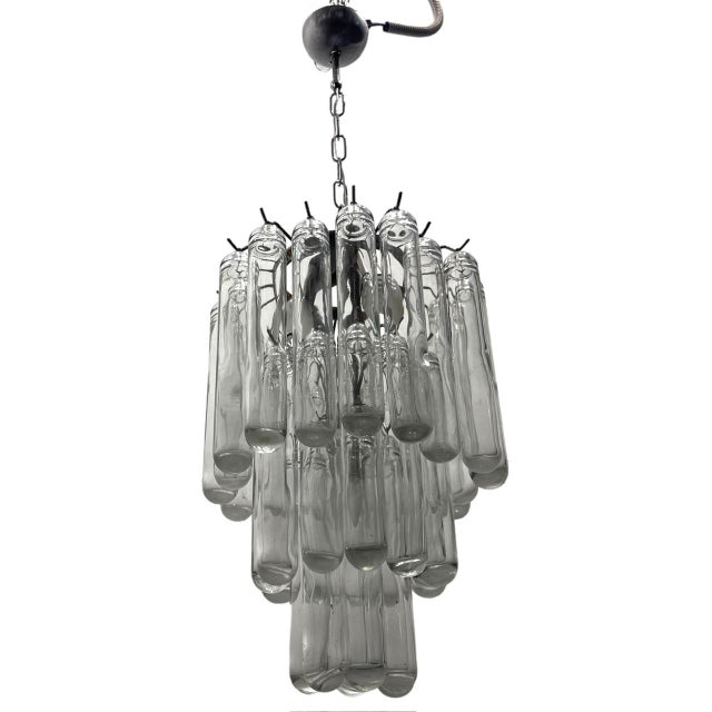 This chandelier is a vintage murano glass tube chandelier, attributed to venini in the 1970s. Here are its specifications:...
